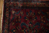 Meandering vine and serpent borders on the corner of a fine antique Persian Lilihan rug.