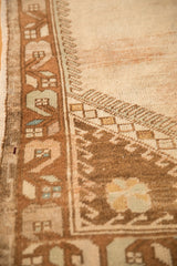 Evenly worn texture of a vintage Oushak's geometric border in brown and seafoam green.