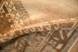 Even, low-pile wear and soft hand-knotted texture of a distressed vintage Oushak.