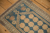 Intact side cord and floral border detail on a distressed hand-knotted Oushak rug.