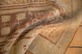 Hand-knotted texture of a distressed Anatolian rug showing even wear to the pile.