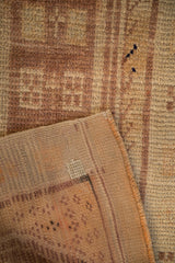 Reverse weave and hand-knotted pile of a distressed vintage Anatolian rug.