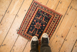 Antique Caucasian Soumac rug shown from above to illustrate its small scale on a floor.