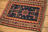 Close-up of the woven 1914 date inscription on the antique Caucasian Soumac.