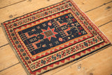 Close-up of the woven 1914 date inscription on an antique pictorial Caucasian Soumac rug.