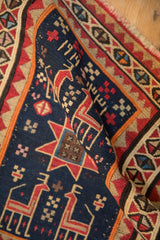 Woven 1914 date inscription and pictorial animal motif on an antique Caucasian Soumac rug.