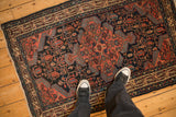 Looking down at the vintage Persian Tajabad rug to show its real-life scale.