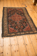 Vintage Persian Tajabad rug seen from a high angle, displaying its full medallion design.