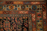 Intricate crab-stylized main border and scrolled florals on an antique hand-knotted Hamadan rug corner.