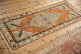 Perspective view of the vintage Oushak runner highlighting its elongated medallion.