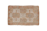 Distressed vintage Oushak rug mat, muted ivory and terra cotta geometric medallion, 1'7