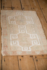 Vintage distressed Oushak rug pile with even wear and original side selvage.