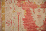 Detail showing mostly even wear across the knot heads of a hand-knotted Turkish Oushak rug.