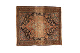 Antique Sarouk square rug with an oversized medallion and floral field in navy blue, dusty sandalwood, and pale celadon green.