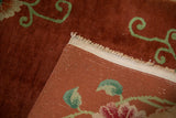 Close-up of the vintage Art Deco rug's intact side cord selvage and hand-knotted foundation.