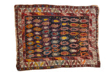 Antique Caucasian rug with a densely ornamented field of colorful boteh on a navy ground and geometric borders.