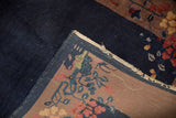 Corner of a vintage Art Deco rug revealing the hand-knotted back and cobalt blue pile.