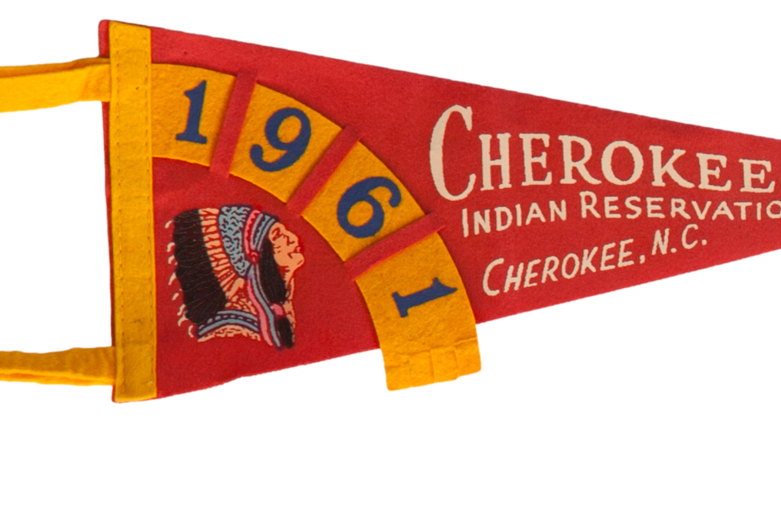 Vintage felt pennant detail of the 1961 date and Native American headdress graphic.