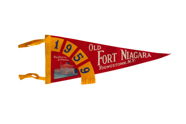 Vintage 1959 Old Fort Niagara souvenir pennant in red felt with yellow graphics and tassels.
