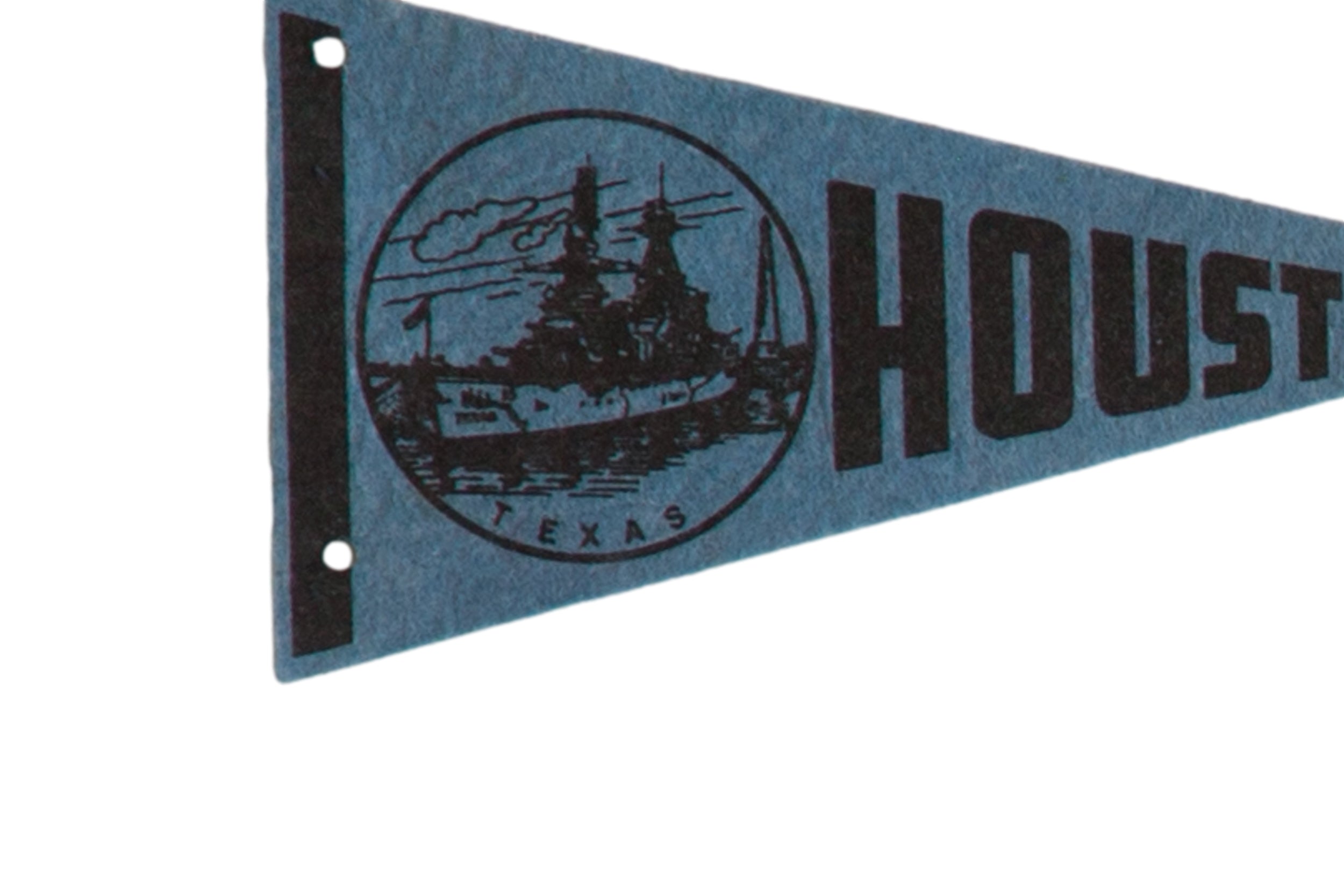 Detailed view of the battleship logo and black left border on a blue felt Houston pennant.