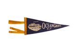 Vintage Ocean Grove N.J. felt pennant in dark blue with a Casino graphic and bright yellow tassels.