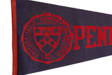 Detailed view of the red University of Pennsylvania crest on the textured navy blue felt.