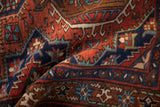 Deeply saturated colors and plush wool pile of a vintage hand-knotted Persian Karaja rug.