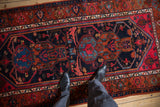 Vintage hand-knotted Kurdish Hamadan rug: navy field, red, rust, sky blue geometric floral patterns.