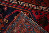 Kurdish Hamadan rug corner revealing hand-knotted navy pile and intricate woven backing.