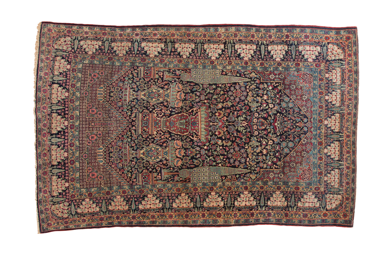 Antique Tehran rug with a unidirectional tree-of-life design, navy field, and symbolic pomegranate borders.