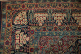 Detailed corner of an antique Tehran rug with symbolic pomegranate bowl motifs in its intricate borders.