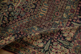 Folded corner of a Collector antique Tehran rug showing its dense pile and detailed floral motifs.