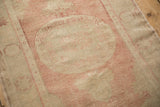 Evenly worn texture showing the low pile on the sand and blush Oushak medallion.