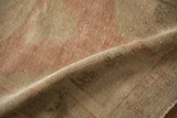 Evenly worn, hand-knotted pile of a vintage Turkish rug showing its foundation.