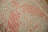 Mostly even wear across the hand-knotted pile of a distressed vintage Turkish rug.