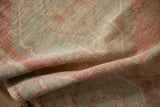 Soft, distressed texture showing the low, even wear on a vintage Oushak rug pile.