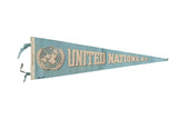 Vintage United Nations New York felt pennant in light blue with its classic off-white logo and text.