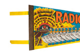 A vintage felt pennant showing the detailed stage graphic, Impko copyright, and handwritten date.