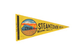 Vintage Steamtown USA souvenir felt pennant in yellow, featuring a steam train graphic at sunset.