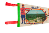 Handwritten 1970 date on the green hoist of a vintage felt pennant, beside a Canadian Mountie.