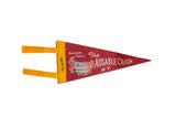 Vintage Ausable Chasm pennant in red felt with a colorful waterfall graphic and golden yellow ties.