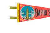 Graphic of the Empire State Building and handwritten 1968 date on a vintage souvenir pennant.