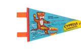 Close-up of the water skiing tiger graphic with a handwritten 1975 date on the vintage felt pennant.