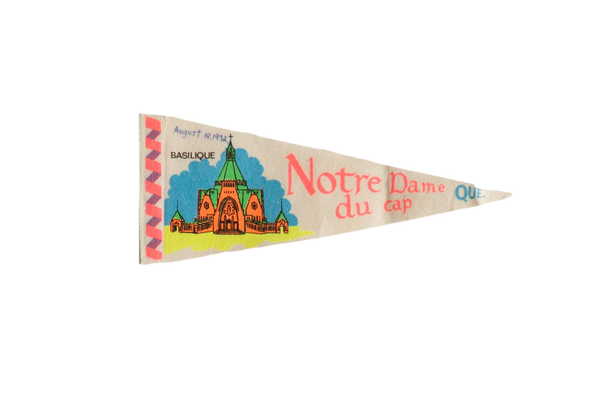 Vintage Notre Dame du Cap Quebec felt pennant with a colorful orange and green Basilica graphic.