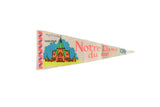 Vintage Notre Dame du Cap Quebec felt pennant with a colorful orange and green Basilica graphic.