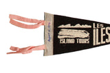 Close-up of the pennant's header showing coral-pink ties and a handwritten 1972 date.