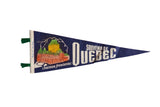 Vintage blue felt souvenir pennant with a colorful illustration of Quebec's Chateau Frontenac.
