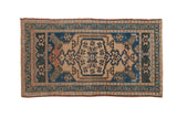 Distressed Oushak rug with central floral medallion in sandalwood, cobalt blue, and teal, 2x3.7.