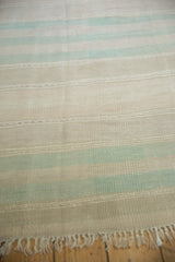 Textured beige and mint horizontal bands on a vintage Turkish Kilim runner.