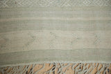 Textured vintage Turkish Kilim with raised woven elements, light beige and soft blue horizontal bands.